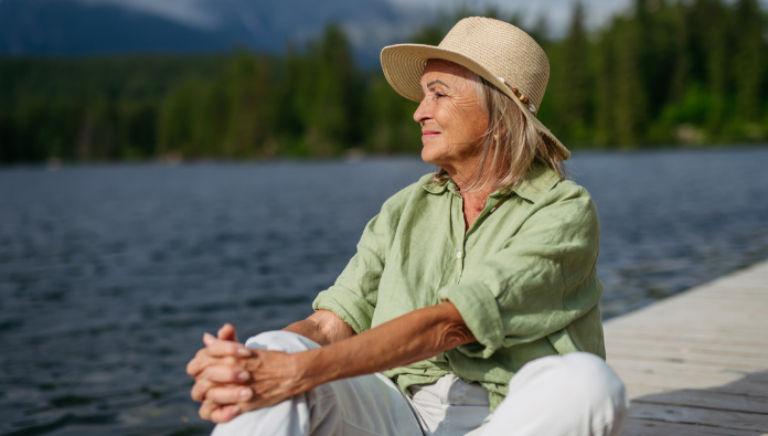 A woman on a deck on a lake A woman on a deck on a lake